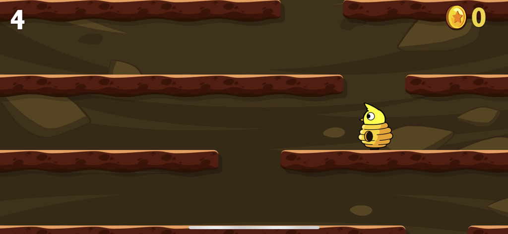 A yellow duckling in a beehive costume standing in an underground climbing level