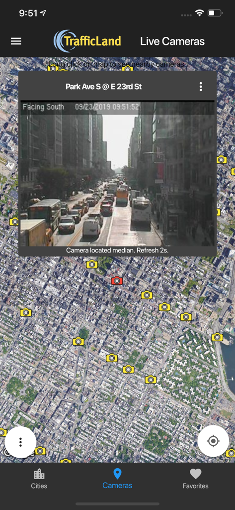 TrafficLand app map interface showing camera icons and a live traffic feed of a city intersection.