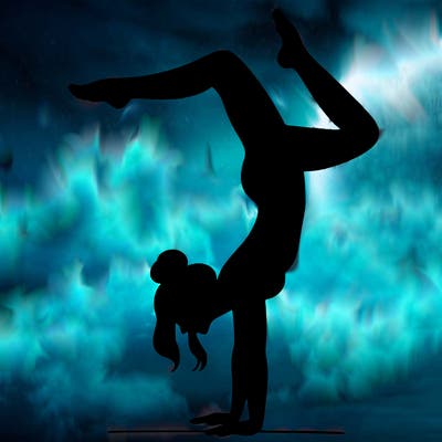 a woman doing a handstand