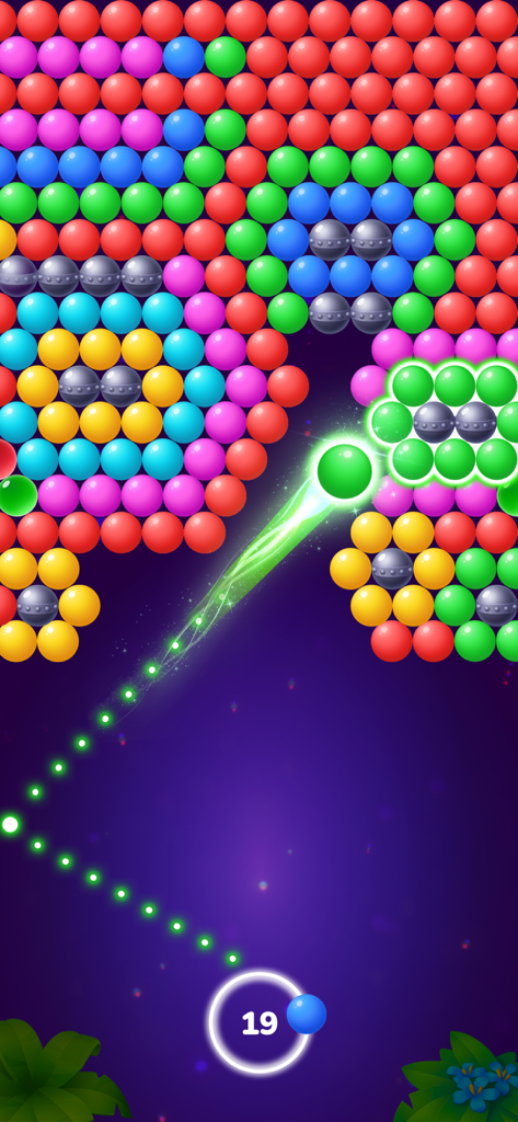 Jugabilidad de Bubble Shooter Tale mostrando burbujas de colores y una guía de trayectoria para disparar