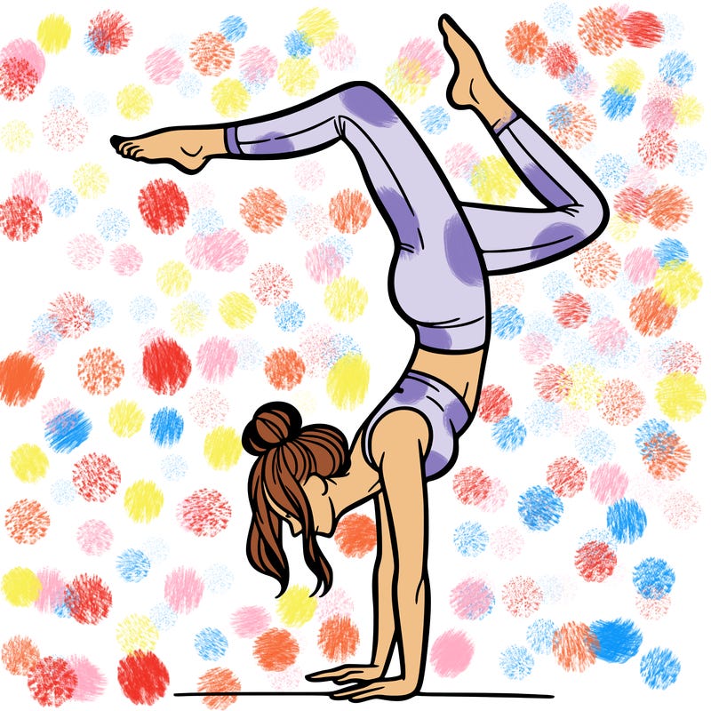 a woman doing a handstand