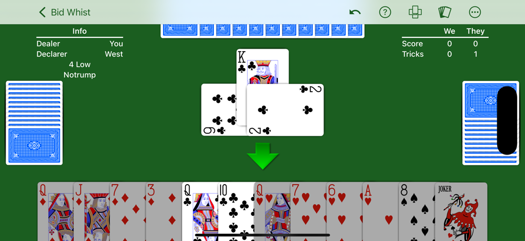 Bid Whist card game interface showing cards in hand and played tricks on a green table