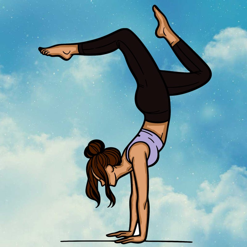 a woman doing a handstand