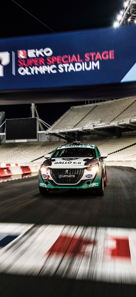 GOCAR Magazine - Automotive - A rally car racing on the track at the EKO Super Special Stage in the Olympic Stadium featured in GOCAR Magazine.