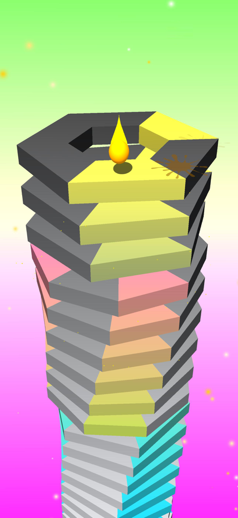 Yellow ball landing on a colorful rotating tower in Crush Ball game