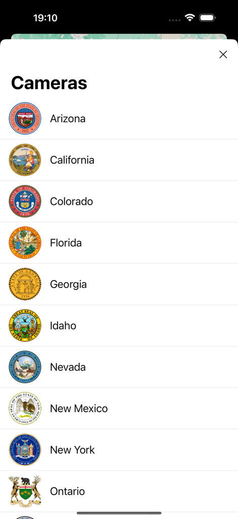 A menu in the USA Traffic Cameras app showing a list of supported states with their official seals