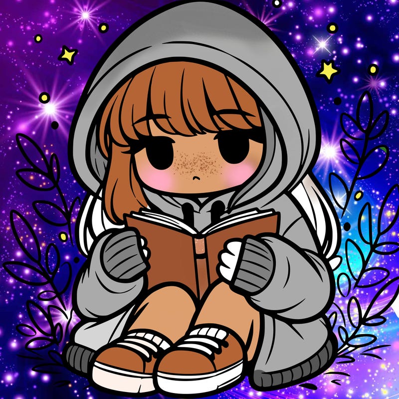 girl in oversized hoodie reading a book