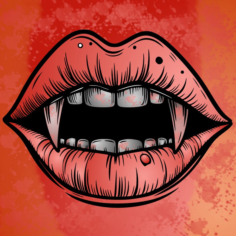 lips with vampire teeth