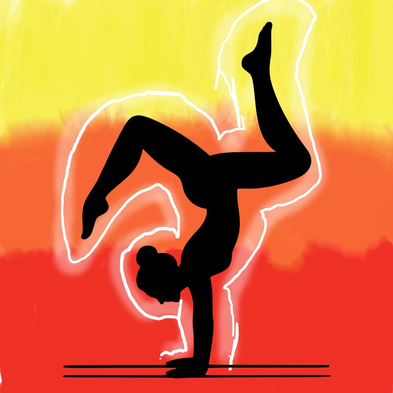 a woman doing a handstand