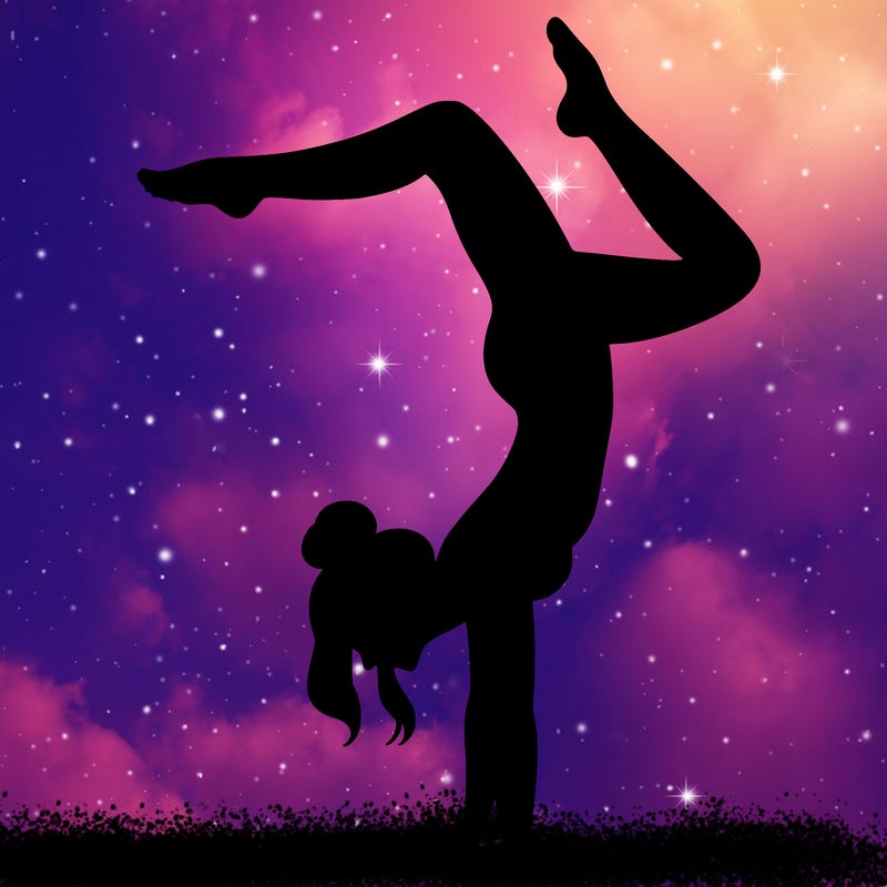 a woman doing a handstand