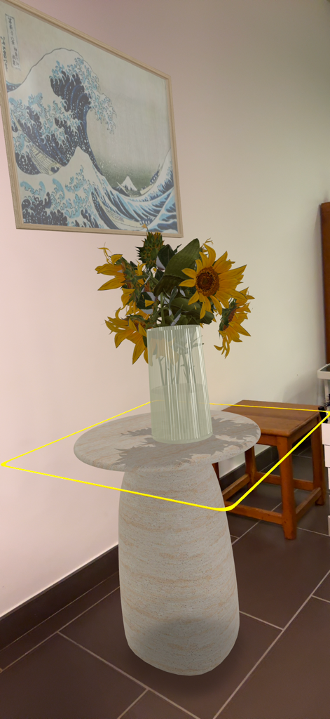 HomeByMe Reality – Deco 3D - Augmented reality view of a 3D vase of sunflowers on a pedestal table