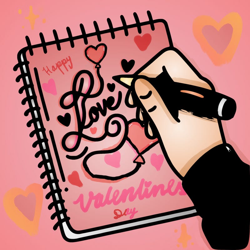 a hand writing “love” in calligraphy on a notebook