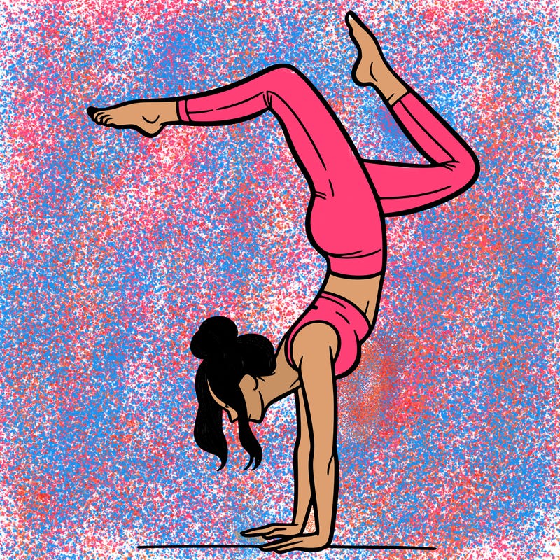 a woman doing a handstand