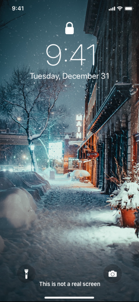 Snowy city street at night on an iPhone lock screen