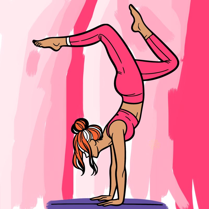 a woman doing a handstand