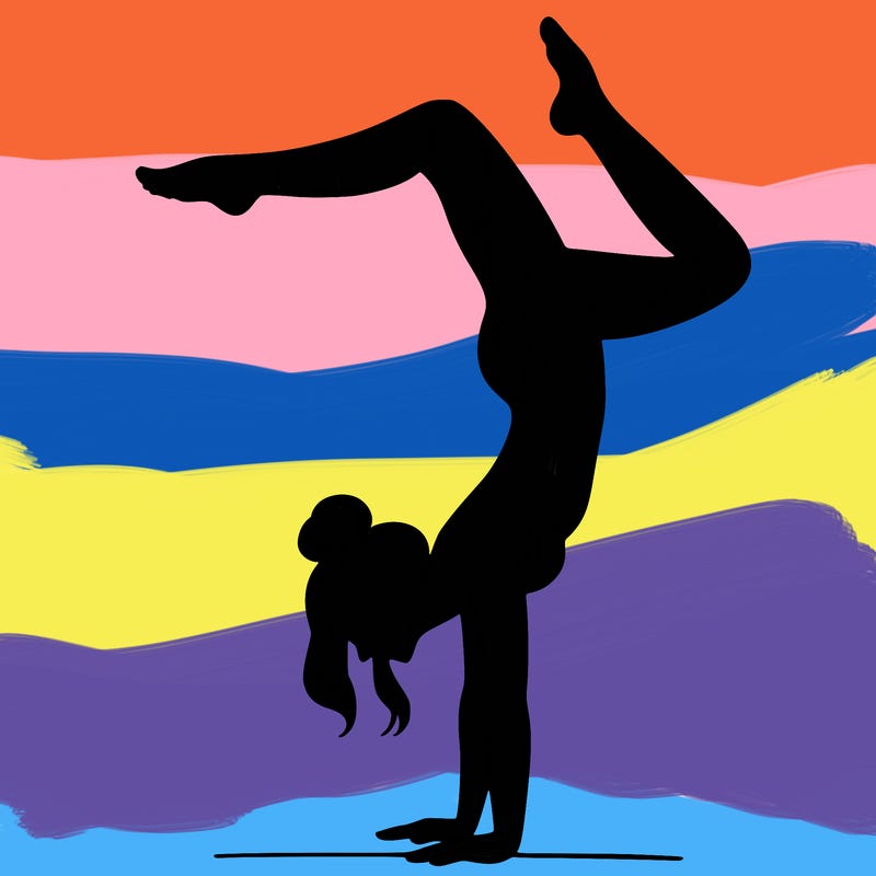 a woman doing a handstand