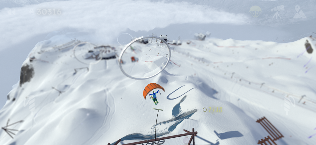 Grand Mountain Adventure 2 - Un personaggio in parapendio attraverso anelli aerei sopra un vasto paesaggio montano innevato in Grand Mountain Adventure 2.