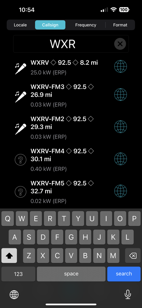 Searching for FM radio stations by callsign in the FM Towers USA app showing frequency and distance information