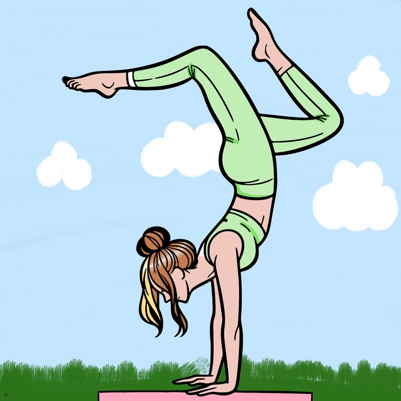 a woman doing a handstand