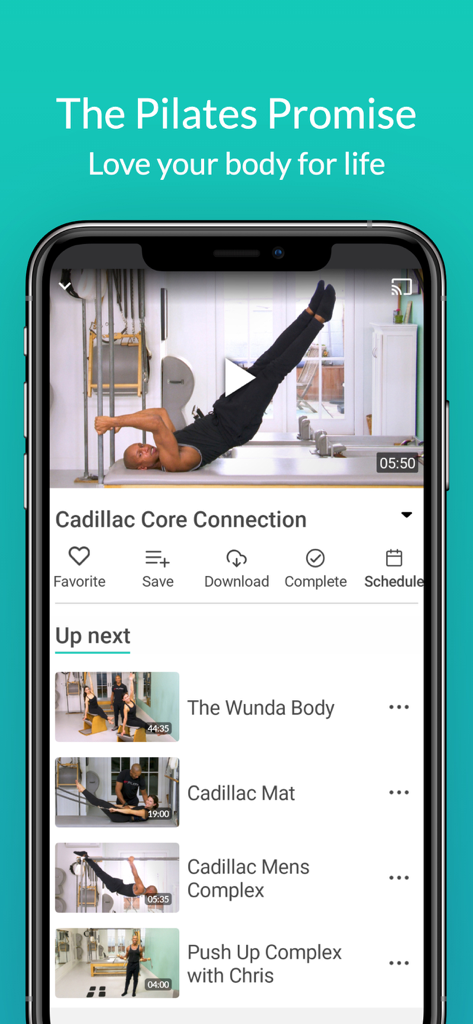 Smartphone screen showing the Pilatesology app video player with a Cadillac Pilates workout