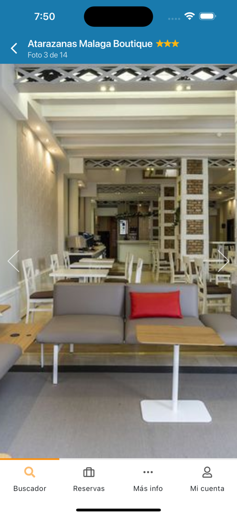 QueHoteles.com - QueHoteles app interface showing a photo of the Atarazanas Malaga Boutique hotel lobby