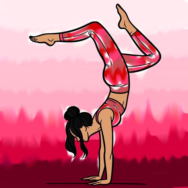 a woman doing a handstand