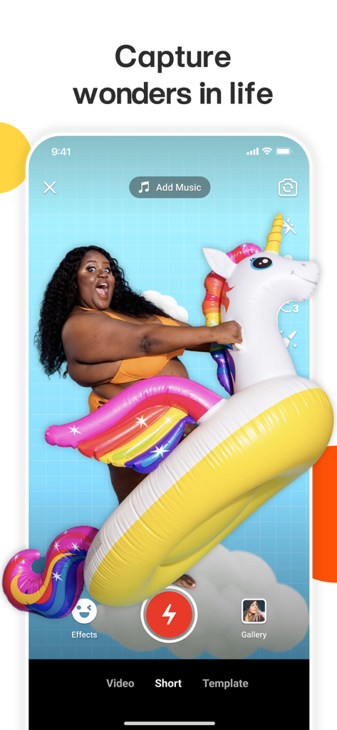A woman recording a fun video on a large inflatable unicorn using the Kwai app interface.