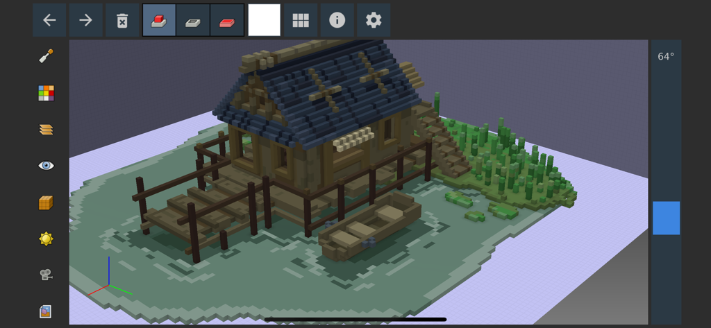 Um modelo voxel 3D de uma cabana à beira do lago e um barco a remos a ser editado na interface da aplicação Goxel