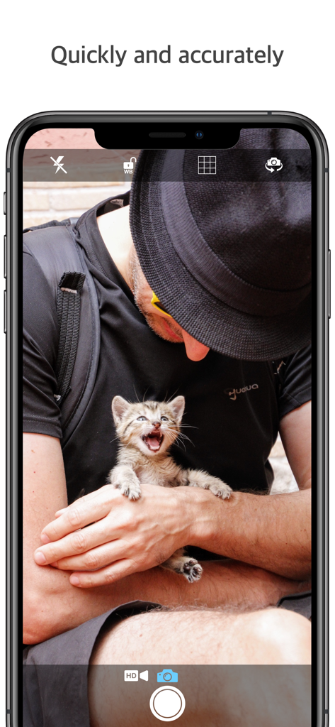 Screenshot of Q Camera app interface capturing a high resolution photo of a man holding a small kitten