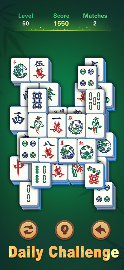 Mahjong Scapes® - Gameplay of Mahjong Scapes showing the daily challenge with large clear tiles and a zen green background