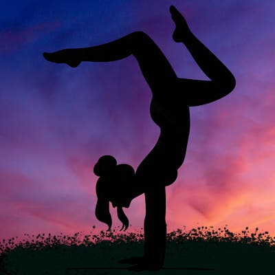 a woman doing a handstand