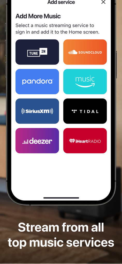 Ein mobiler App-Bildschirm, der integrierte Musik-Streaming-Dienste anzeigt, darunter SoundCloud, Pandora, Amazon Music und TIDAL in der HEOS App.