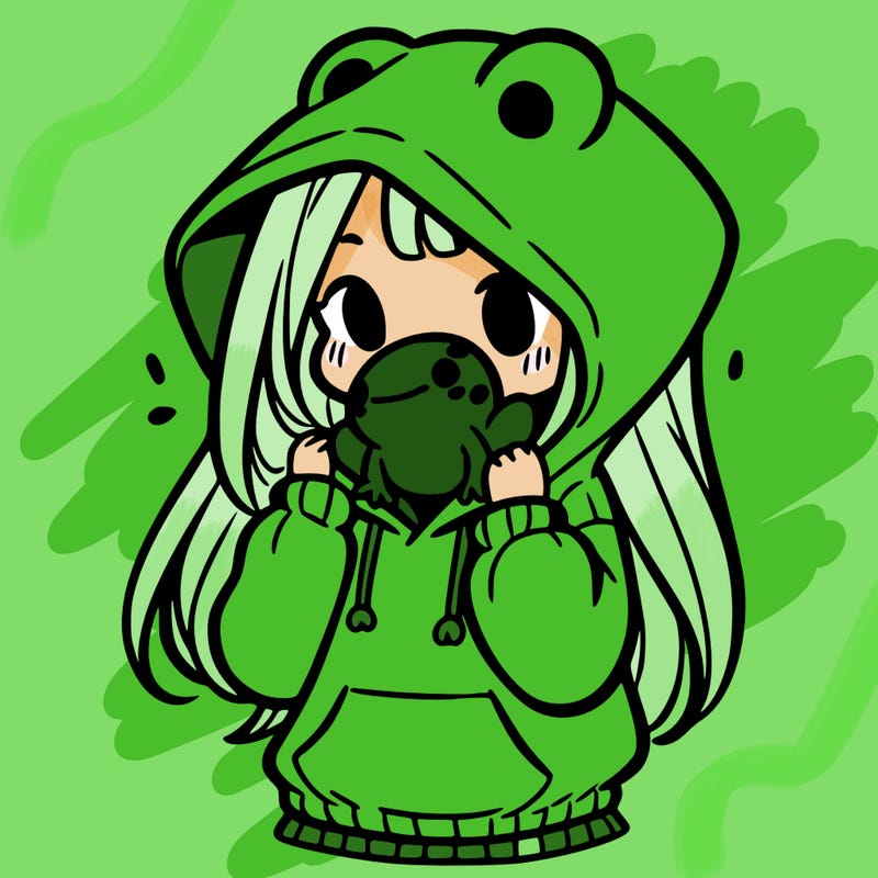 a girl holding a froggy hoodie