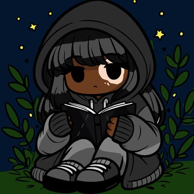 girl in oversized hoodie reading a book
