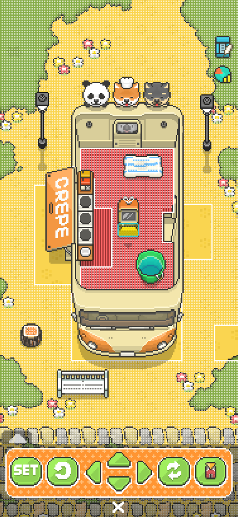 Food Truck Pup - Top-down pixel art view of a crepe food truck being decorated with cute dogs and furniture in a park.