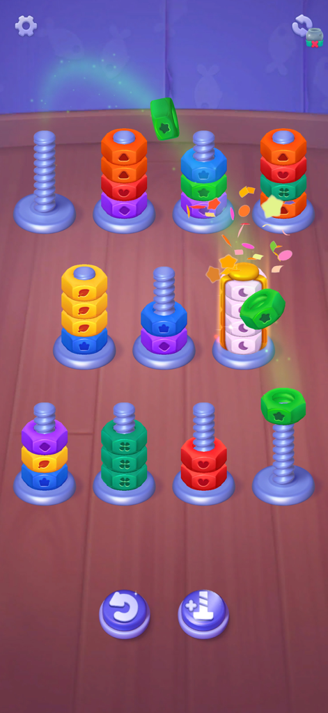 Nuts UP! Bolts Sort Puzzle - A colorful mobile puzzle game screen showing various nuts being sorted by color on metal bolts.