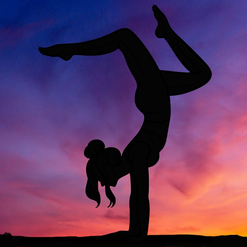 a woman doing a handstand