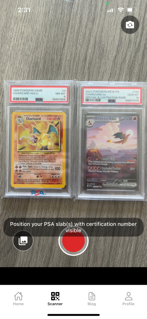 Misprint app interface scanning two PSA graded Charizard Pokemon cards