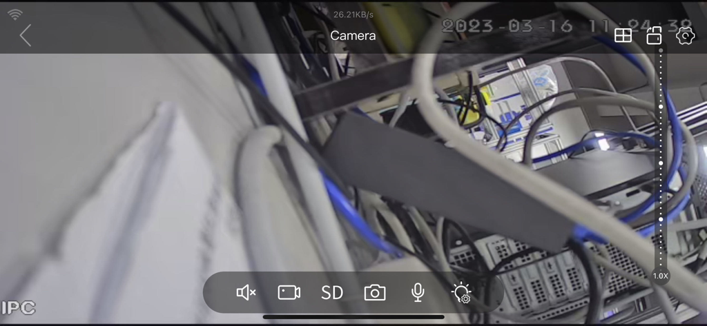 Tris Home - Tris Home app showing a live security camera feed of server room cables and hardware equipment