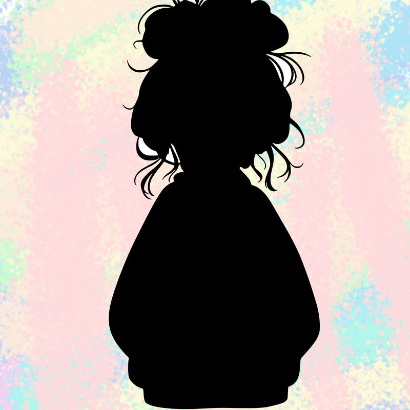 girl with baggy sweatshirt and messy bun