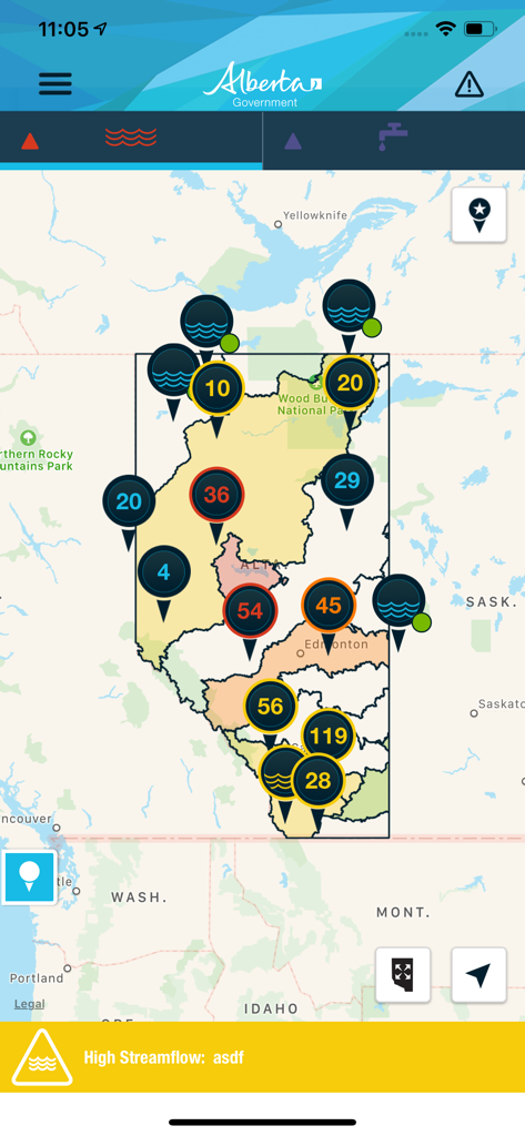 Alberta Rivers app map view showing monitoring stations with flow levels and a high streamflow advisory alert