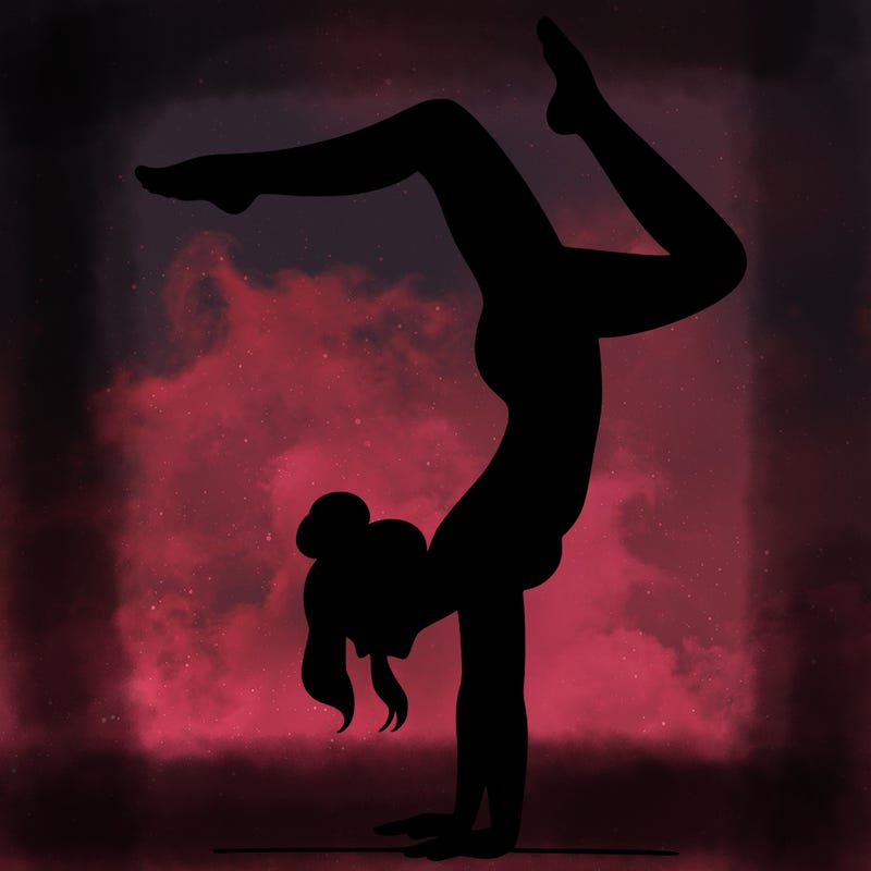 a woman doing a handstand
