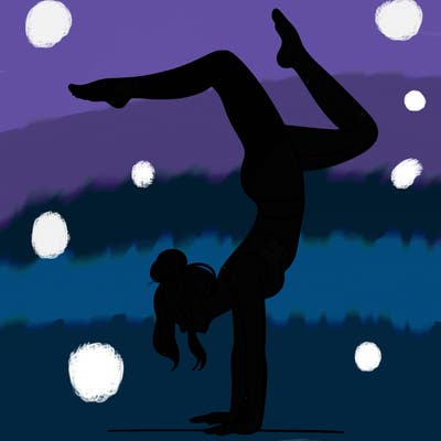 a woman doing a handstand