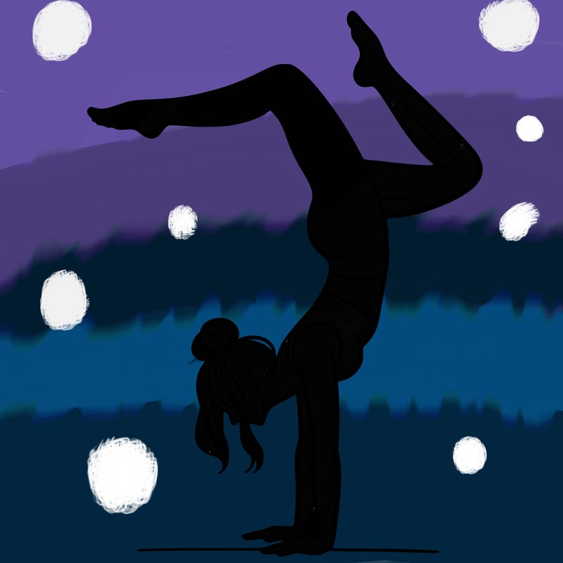 a woman doing a handstand
