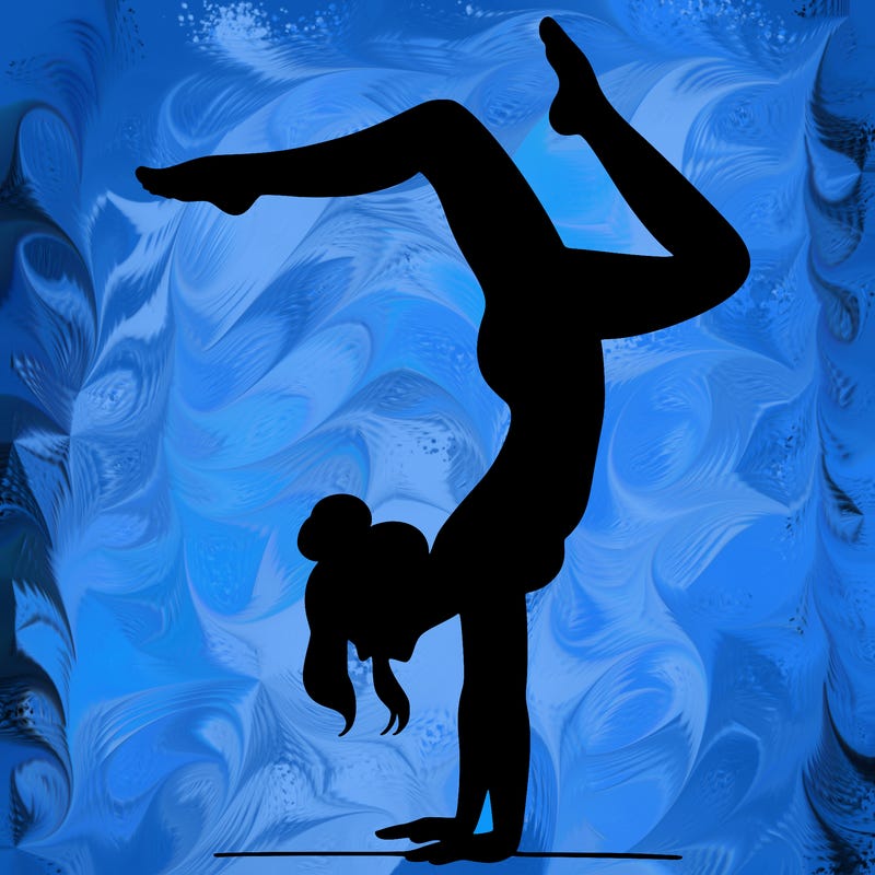 a woman doing a handstand