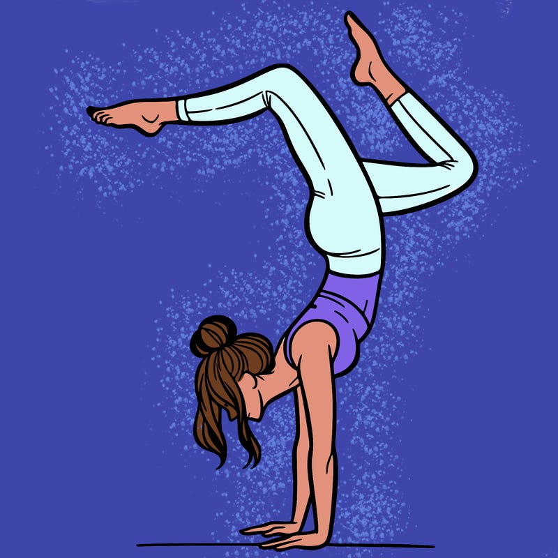 a woman doing a handstand