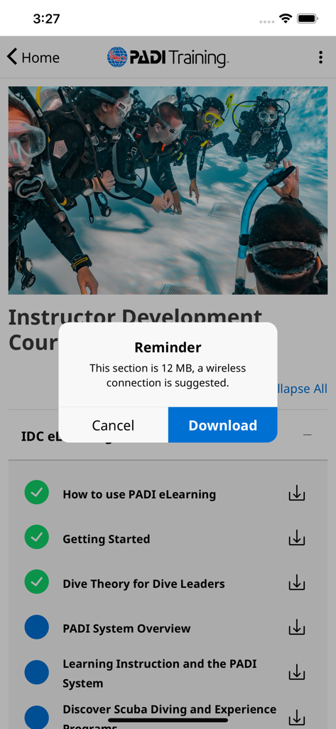 PADI Training app showing a download reminder for diving course materials
