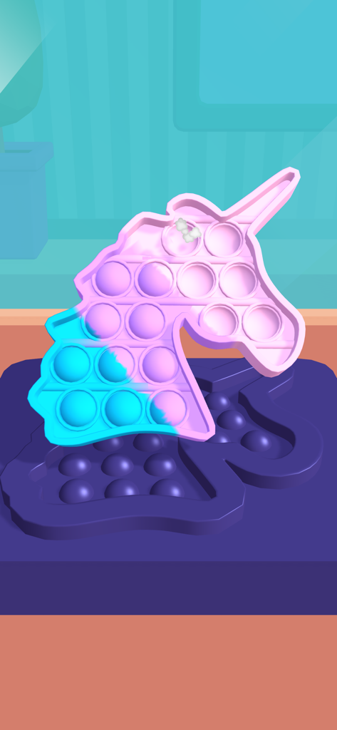 A pink and blue unicorn shaped pop it fidget toy being crafted in a digital mold.