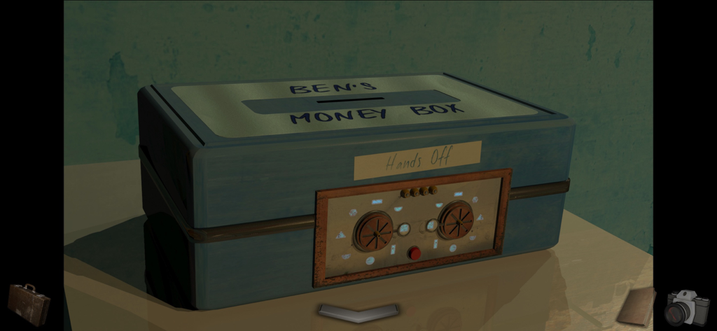 A Short Tale - A blue metal money box with a mechanical puzzle lock labeled Bens Money Box