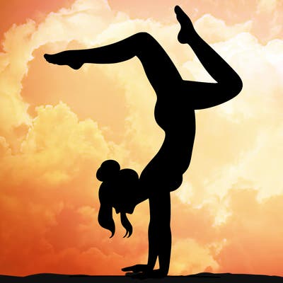 a woman doing a handstand